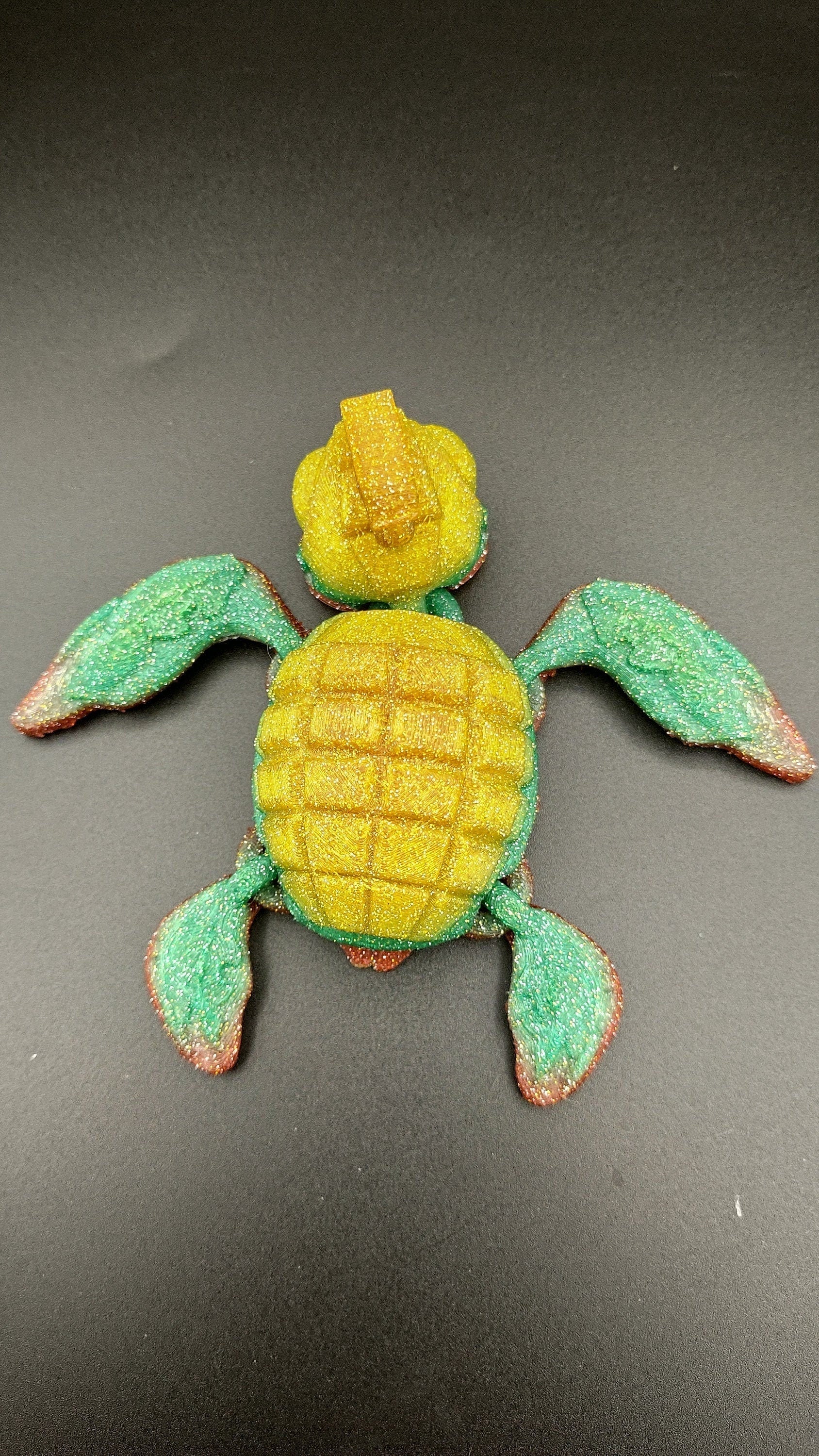 Sparkle Rainbow, (Red, Green, Yellow Gold,) Grenurtle, grenade / turtle 3d printed (made) adult desk fidget toy. Sensory turtle buddy.