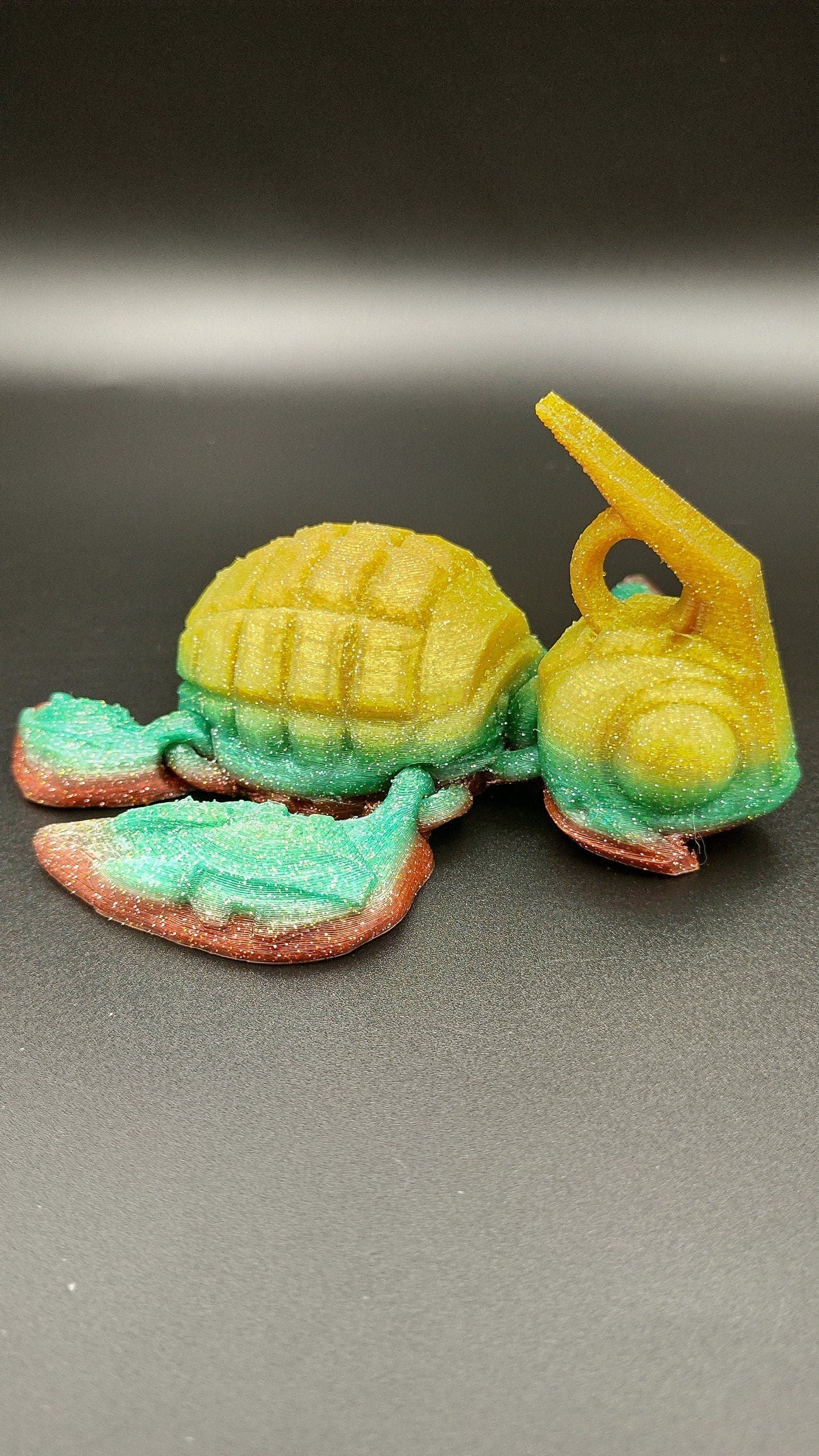 Sparkle Rainbow, (Red, Green, Yellow Gold,) Grenurtle, grenade / turtle 3d printed (made) adult desk fidget toy. Sensory turtle buddy.