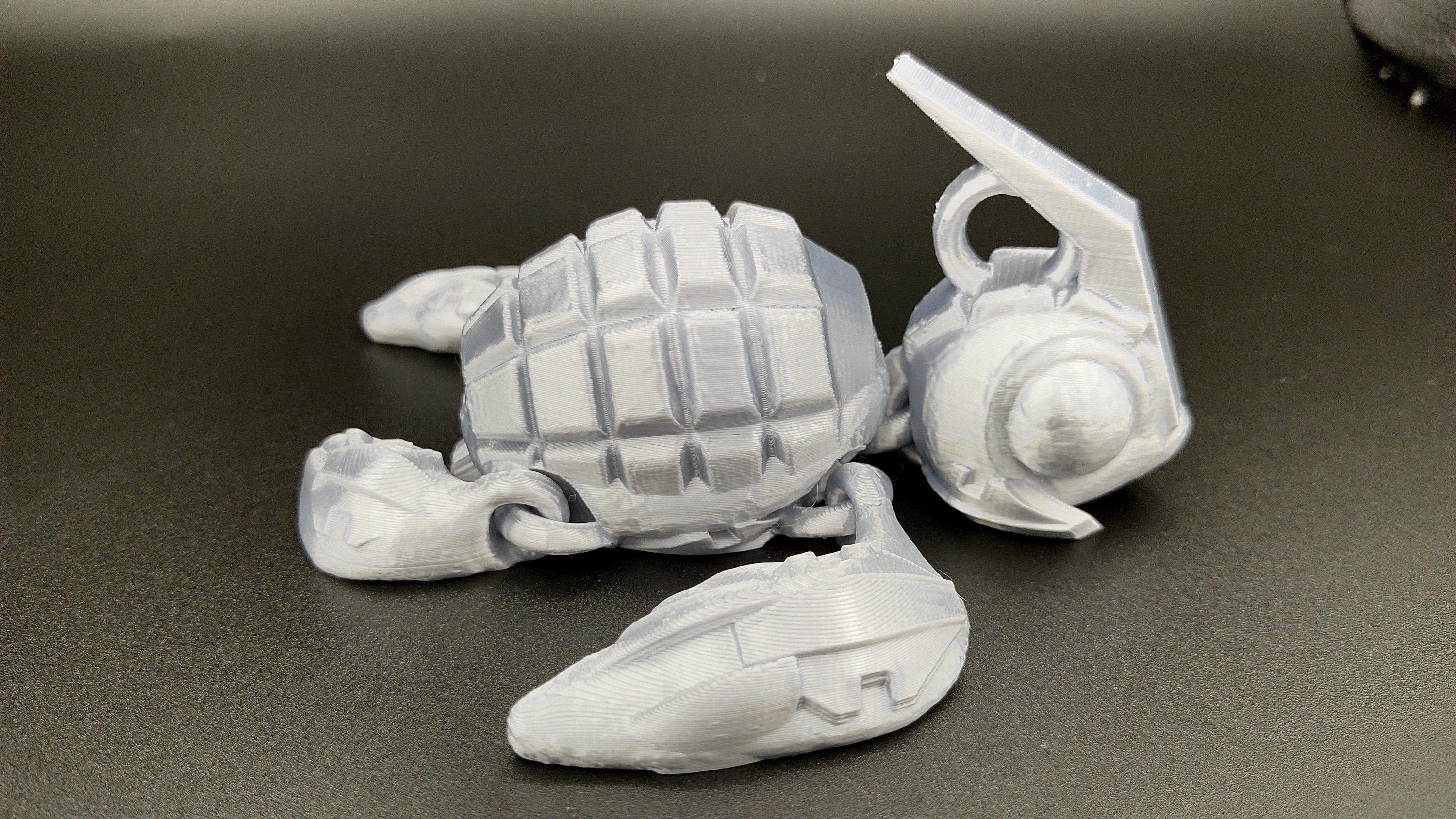 Silver Color Grenurtle, grenade / turtle 3d printed (made) adult desk fidget toy. Sensory turtle buddy.