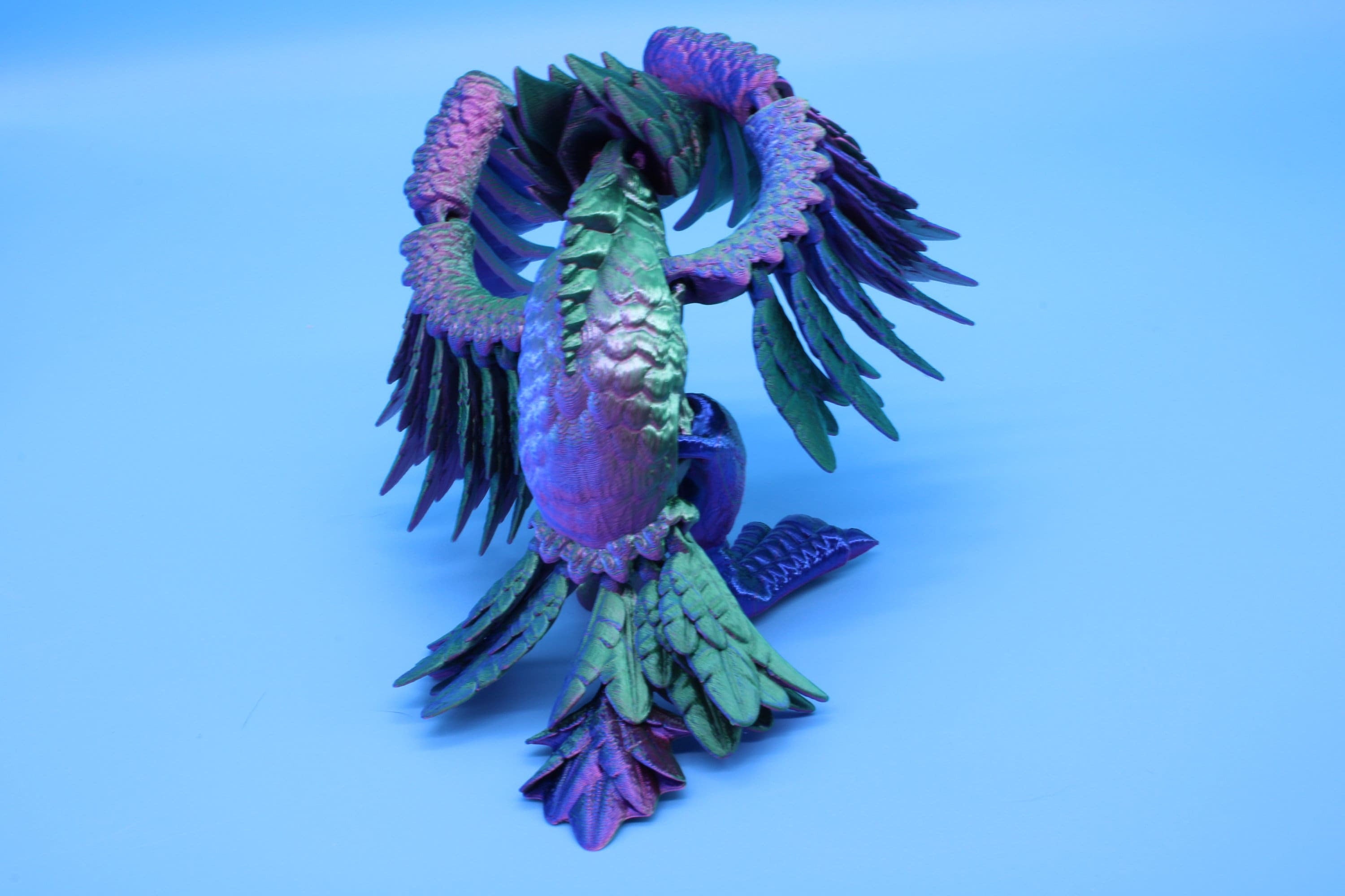 Cute Flexi Multi Color Phoenix. Unique 3D printed. Great Articulating fidget toy, desk, sensory toy. 4 inch Blue, Red, Teal, Green.