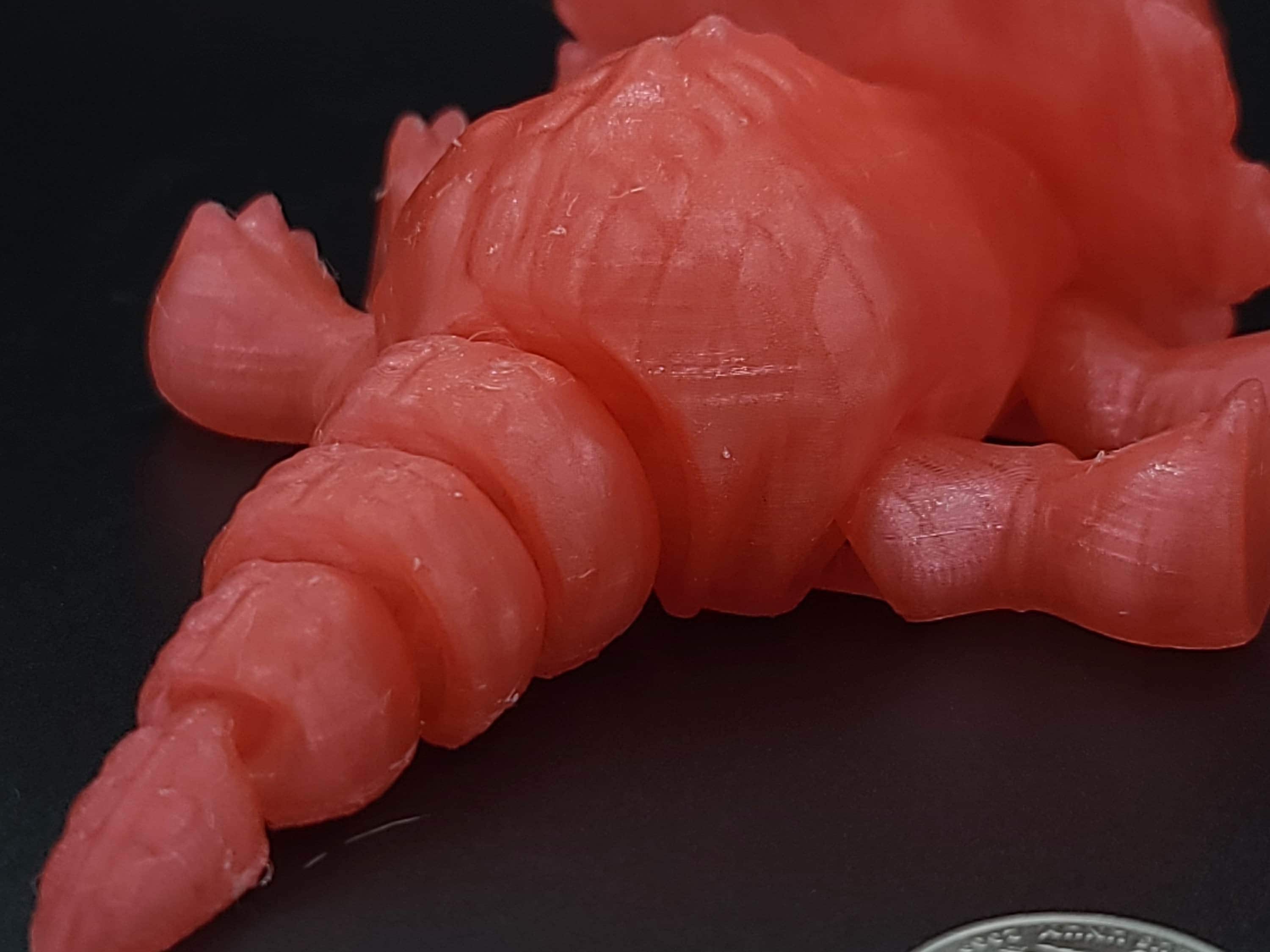 Cute Flexi Watermelon Red Translucent Triceratops. Unique 3D printed Triceratops. Great Articulating fidget toy, desk, sensory toy. 6.5 inch