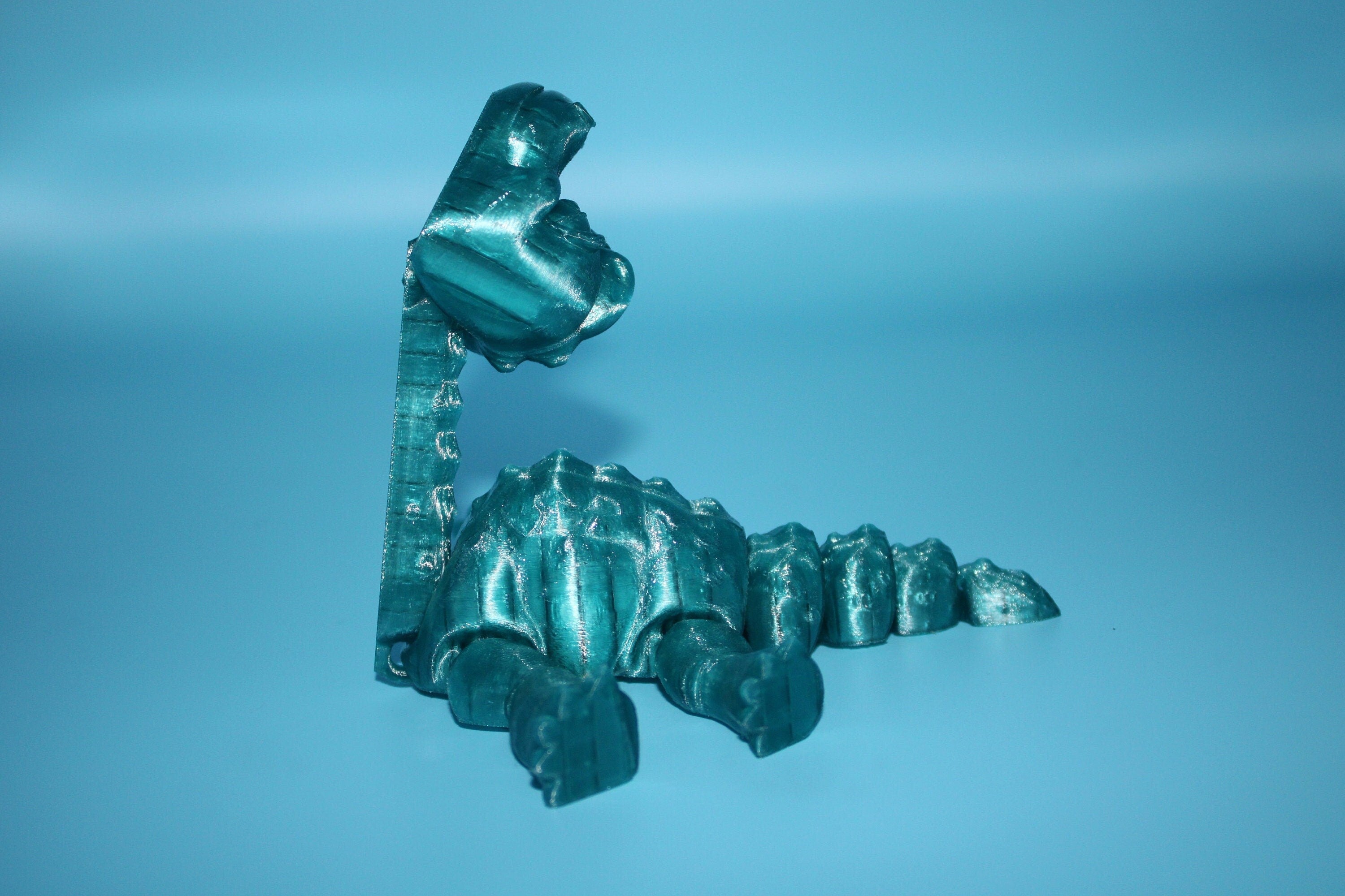 Teal Translucent Brachiosaurus. Cute Flexi Articulating Dinosaur. 3D printed unique dino. Great fidget toy, buddy, desk art / toy. 9 in.