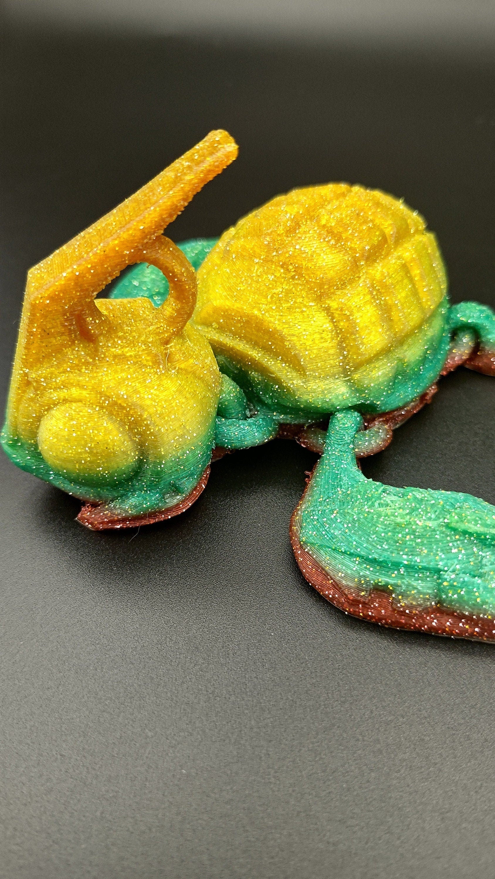 Sparkle Rainbow, (Red, Green, Yellow Gold,) Grenurtle, grenade / turtle 3d printed (made) adult desk fidget toy. Sensory turtle buddy.