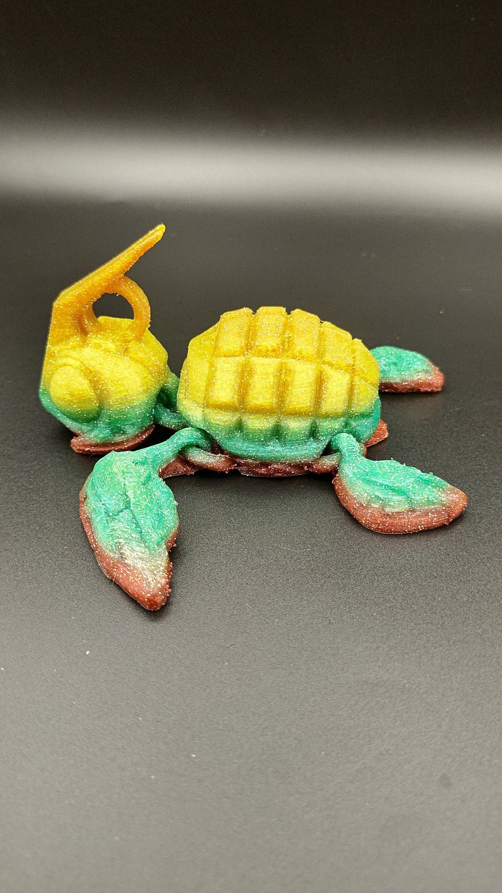 Sparkle Rainbow, (Red, Green, Yellow Gold,) Grenurtle, grenade / turtle 3d printed (made) adult desk fidget toy. Sensory turtle buddy.