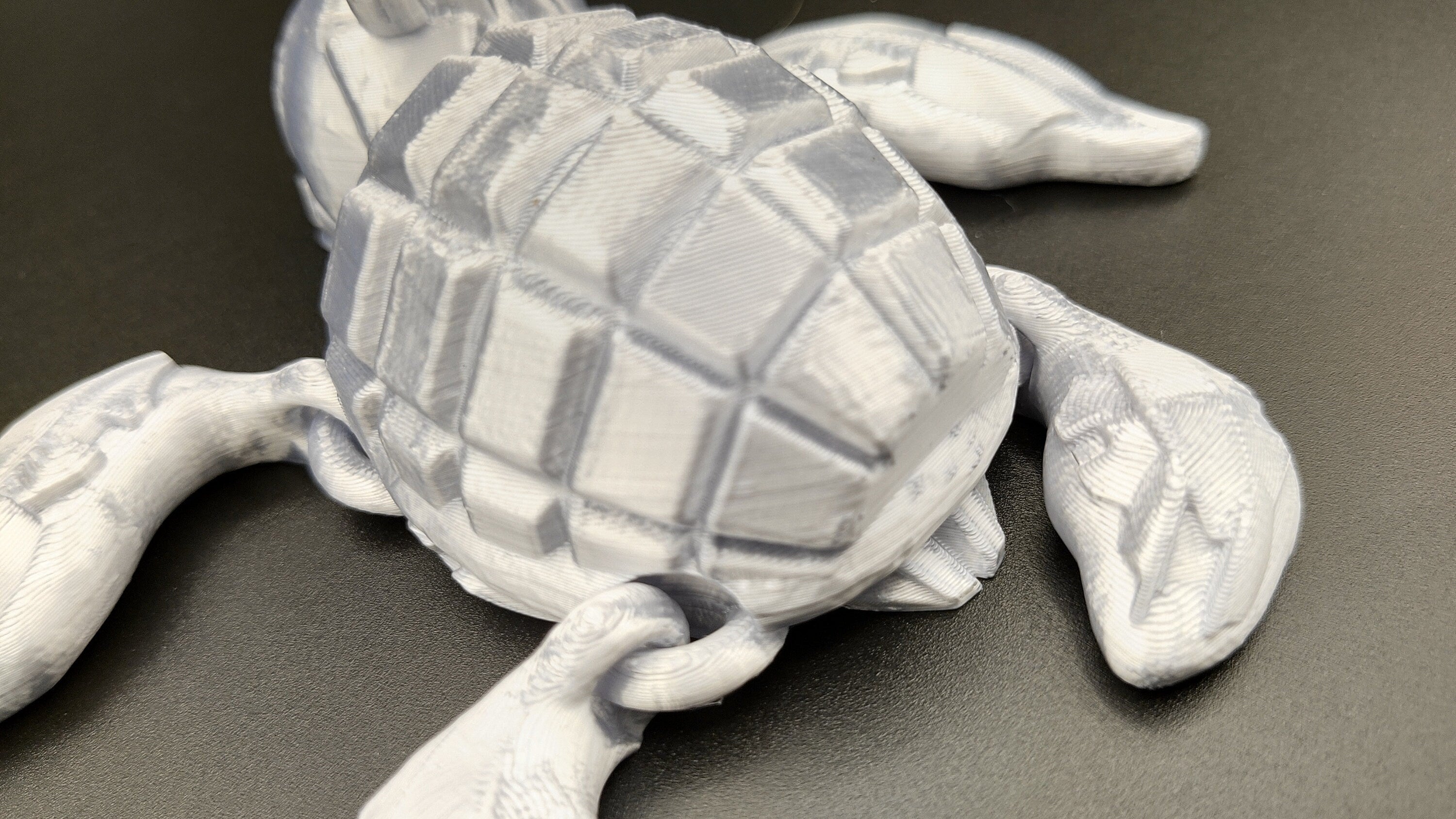 Silver Color Grenurtle, grenade / turtle 3d printed (made) adult desk fidget toy. Sensory turtle buddy.