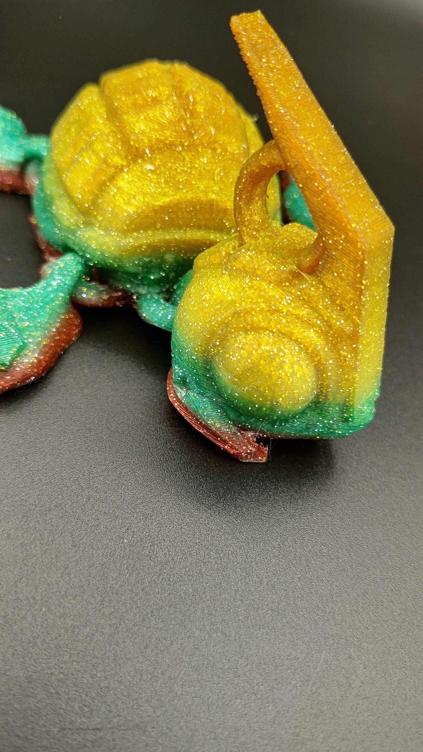 Sparkle Rainbow, (Red, Green, Yellow Gold,) Grenurtle, grenade / turtle 3d printed (made) adult desk fidget toy. Sensory turtle buddy.