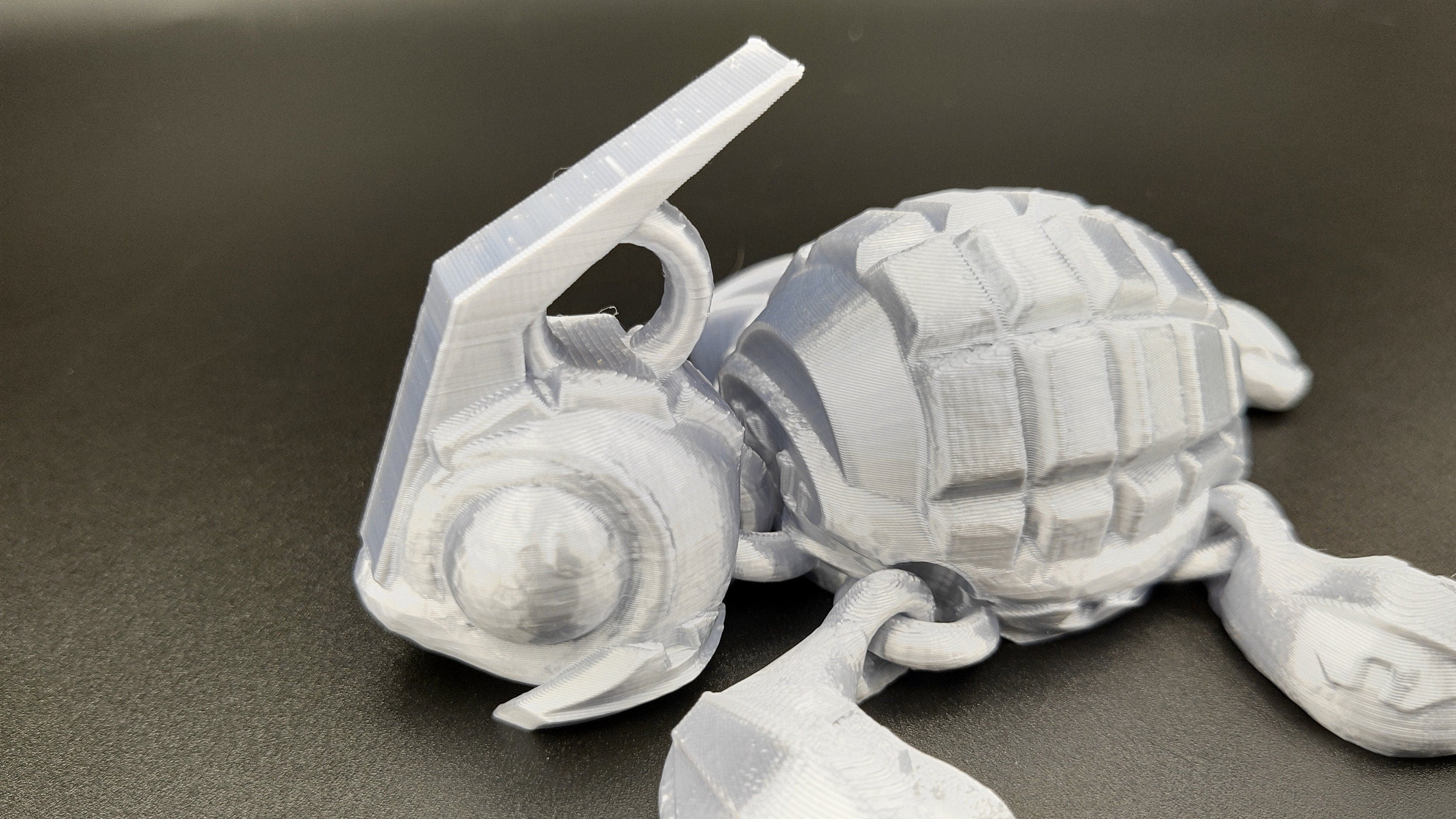 Silver Color Grenurtle, grenade / turtle 3d printed (made) adult desk fidget toy. Sensory turtle buddy.